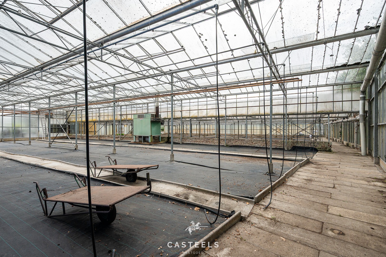 Afbeelding Serre op agrarische grond met logistieke toegangsweg - Casteels Vastgoed