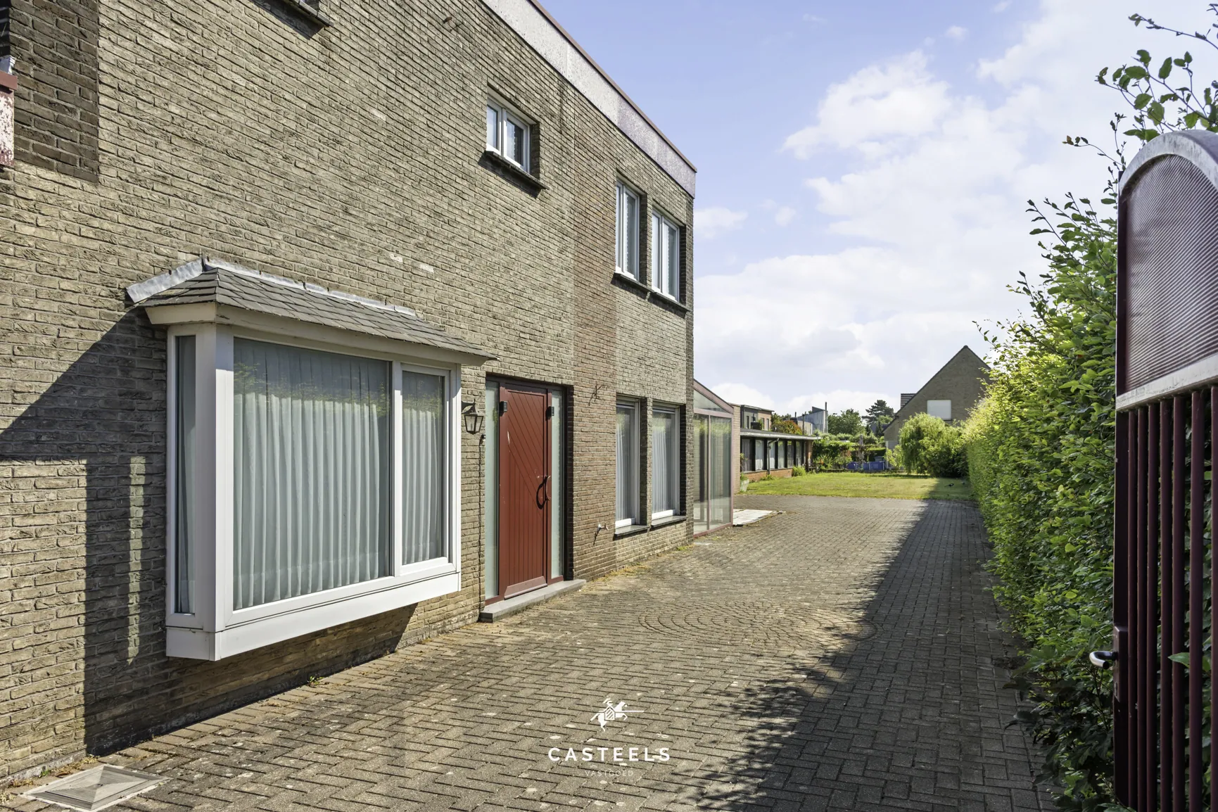 Afbeelding Woning met ruim werkatelier op 1.009 m² in centrum Lochristi - Casteels Vastgoed